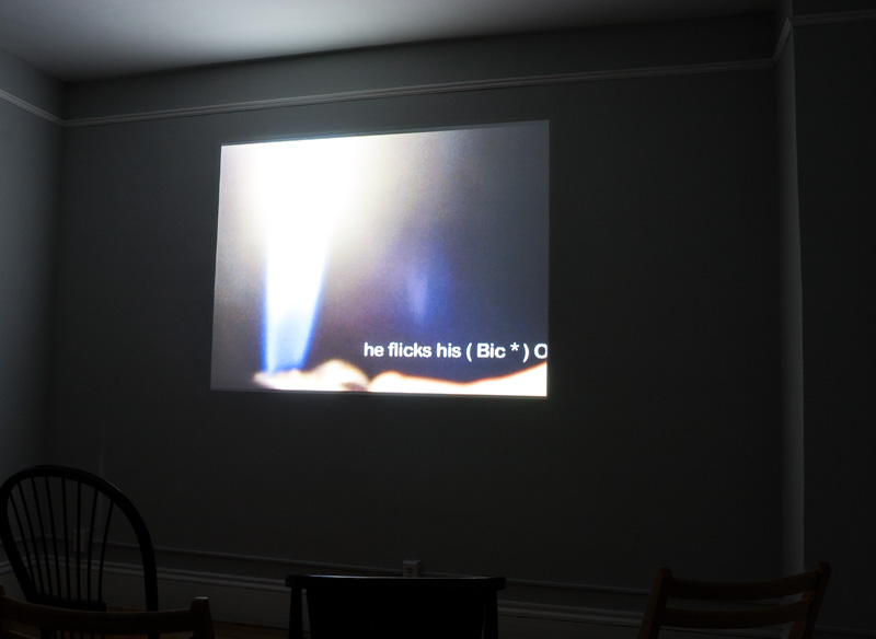 Still of Triple Bill, text next to flame from a lighter